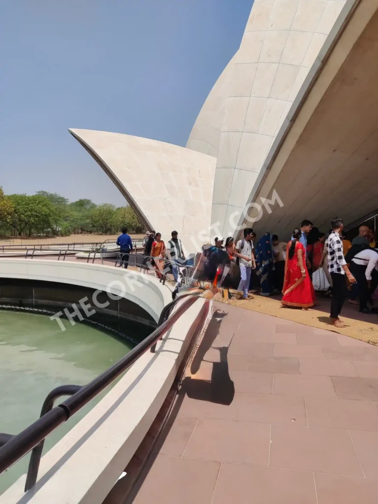 Lotus temple crowd near pool